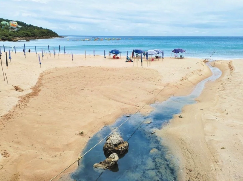 black drain water in nanwan beach