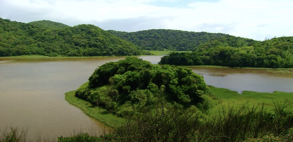 Ringed by hills and surrounded by verdant greenery