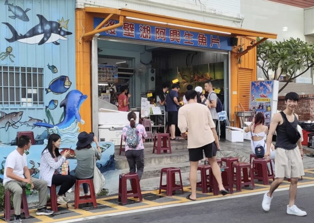 visitors await in line to get a seat in the restaurant in kenting