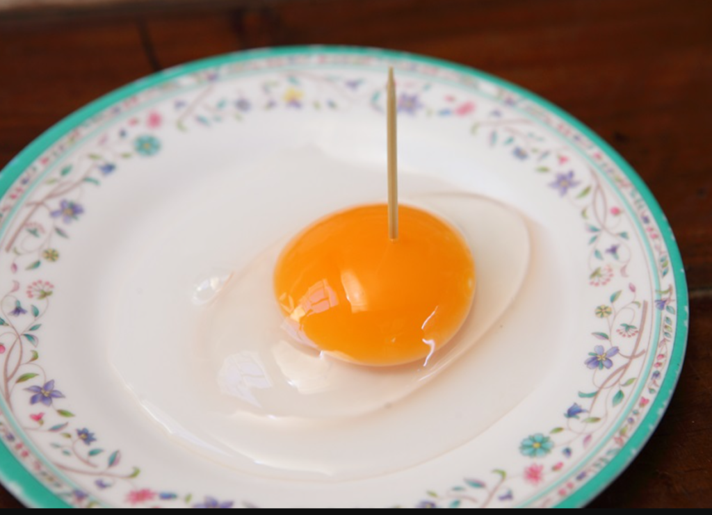 orange hue of pan farm raised eggs